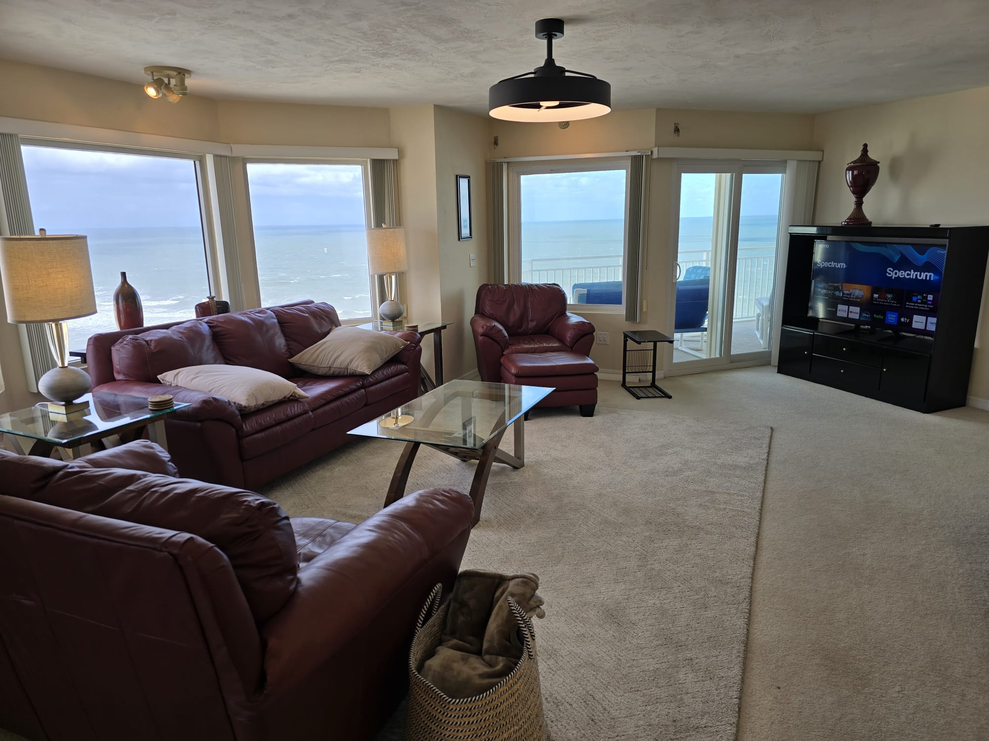 Living room with amazing ocean front view. Complete with WIFI & 50 inch smart TV including basic cable.